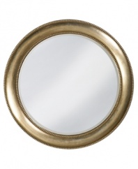Give any room an otherworldly glow with the simply timeless Saturn wall mirror. A round frame in burnished silver with red highlights is edged in classic beading.