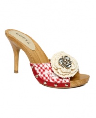 A flirty little throwback. Slip on the Malva sandals by GUESS and get to hot stepping with their embroidered gingham and bejeweled knit flower accent.