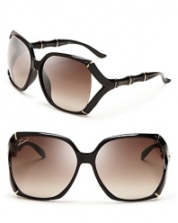 Be a style icon in these eternally chic Gucci sunglasses, with oversized, dark frames and luxe gold accents.