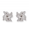 Dainty X-shaped clip on earrings flaunt clear Swarovski crystals in a pavé setting. These silver tone mixed metal earrings bridge the gap between classic and trendy. Approximate diameter: 5/8 inch.