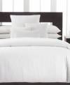 Clean and simple. Calvin Klein's Mykonos duvet cover, inspired by the Greek island of the same name, features a white-on-white circle design for a classic appeal. Hidden button closure.