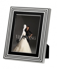Add new elegance to beautiful memories with Vera Wang's With Love Noir picture frame. Geometric detail lends metallic shimmer to chic black enamel in a home accent that invokes modern and deco design.