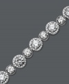 Enlighten your look with a little Arabella. This glamorous tennis bracelet features a unique circular design that highlights dozens of round-cut Swarovski zirconias (22-9/10 ct. t.w.). Crafted in sterling silver. Approximate length: 7 inches.