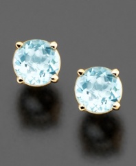 Brilliantly faceted round-cut aquamarine (5 mm) sparkles luminously in these simple yet elegant stud earrings. Set in 14k gold.