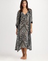 EXCLUSIVELY AT SAKS. Opposites attract in this flowy design featuring a striking tribal-inspired print. V-neckThree-quarter length sleevesSolid trim at the neckline and cuffsSelf-tie waistAbout 53 from shoulder to hemPolyesterMachine washImported