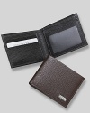 Salvatore Ferragamo Revival bifold wallet. Textured leather bifold wallet with silver engraved Ferragamo plate on front. Features double billfold with three card slots on one side and one window slot with two card slots on the other .