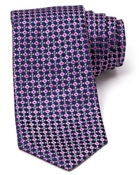 Decadently patterned and teeming with sheen, this luxurious silk tie from Ike Behar puts a new spin on classic refinement with bedazzling squares.