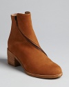 Eileen Fisher zips into the booties trend in this well-crafted style, featuring decorative zippers around each shaft.
