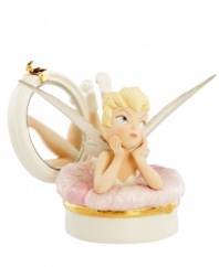 One pretty pixie, Tinker Bell puts her feet up in a compact with a pink powder puff. Delicate glazed and gold detail in Lenox fine china make it a Disney collectible all her fans will cherish.
