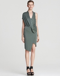 From coffee with clients to cocktails with friends, this Helmut Lang dress delivers. A practice in asymmetry, the silhouette appears to wrap across your bodice, draping at the front, but, in fact, the style is in the detail. Continue the modernity with chunky sandals and tough-luxe accents.