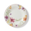 Crafted from premium porcelain, the Mariefleur dinner plate boasts a refreshingly modern watercolor design with bright pinks, light greens and sunny yellows.