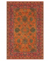 Drawing inspiration from the sandy ruins of ancient Petra and the traditional designs of India, this elegant, hand-tufted rug presents a rich decorative history set against a subtle red backdrop and accented with multiple gold and orange tones.