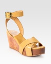 Held in place by a wide adjustable ankle strap, soft leather straps top an earthy wooden wedge and platform. Wooden wedge, 3 (75mm)Wooden platform, 1 (25mm)Compares to a 2 heel (50mm)Leather upperLeather liningRubber solePadded insoleImportedOUR FIT MODEL RECOMMENDS ordering true size. 