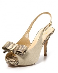 Snake embossed accents lend an exotic air to a slingback sandal in natural linen. From kate spade new york.