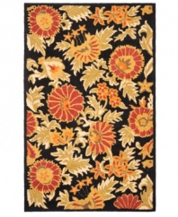 Attractive wildflowers create a sprawling, carefree design upon luxurious, long wool fibers. Woven meticulously in India, the Blossoms area rug from Safavieh presents these florals in bright hues with the modern home in mind.