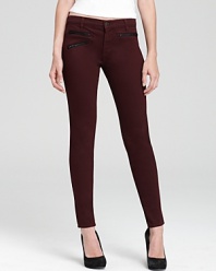 Exposed front zips lend cutting-edge cool to these J Brand skinny jeans, rendered in a rich hue.
