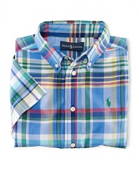 A tried-and-true button-front design is rendered in a vibrant madras plaid.