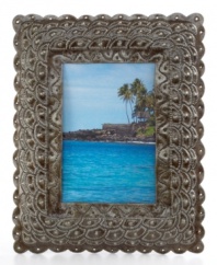 From steel barrels to artful display, this eco-friendly picture frame is painstakingly cut and carved by esteemed Haitian artisans. A scalloped design evokes the scales of a mermaid's tail, bringing a touch of fantasy to any landscape.