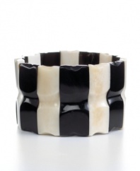 Cow horn turned chic. Handcrafted by talented Haitian artisans, this beaded stretch bracelet brings bold, organic style and new meaning to your jewelry collection in an alternating light and dark design.