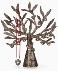 Rooted in tradition. Designed by Charles Brutus, this standing jewelry tree is hand cut from recycled steel and hammered by the artist. Open cutwork in its boughs allow you to hang and display earrings, necklaces and the rest of your jewelry on top of a dresser or table.