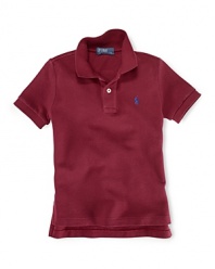 A classic polo shirt crafted from breathable cotton mesh is tailored in a short-sleeved silhouette for preppy, warm-weather style.