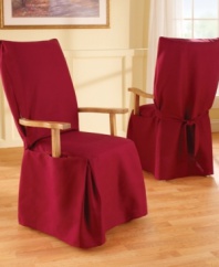 Dense cotton duck instantly transforms any furniture with its broad arm construction and an elegant draping at the bottom. This slipcover also features front pleats for a beautiful all-around drape that accommodates dining room chairs with flared legs.