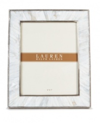 Enhance the look of any photo when framed in the beauty of Mother of Pearl. A slim line of carved steel trim surrounds this natural composition with classic style, only from Lauren by Ralph Lauren.