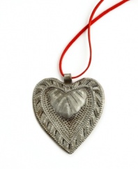 Show heart. Hand-cut and hammered in recycled steel, the Floral Heart pendant is full of unique textured detail and made with love by artisans determined to rebuild their lives. After two coats of varnish, each is dried in the hot Caribbean sun. A beautiful gift.