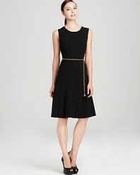 A modern update to the classic LBD, this Calvin Klein dress touts a flared skirt topped with a gold-tone belt for a curve-enhancing silhouette guaranteed to shine.