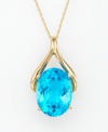An oval-shaped blue topaz (12 ct. t.w.) set within 14k gold wishbone design radiates colorful elegance. Chain measures 18 inches.