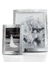 An instant update for elegant interiors, these hammered aluminum picture frames add timeless polish to any image. Two sizes create a balanced display with either portrait or landscape prints. With finished velvet backing.