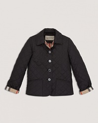 A cozy quilted jacket with a check lined collar and button front.