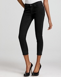 An ultra-cropped silhouette lends a retro feel to these 7 For All Mankind skinny jeans, rendered in sleek black.