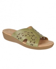 Lovely cut-out detailing lends intrigue to the smooth leather of the Waver slides by Naturalizer. This casual style, available in earthy tones, is perfect for taking a walk or enjoying lunch.