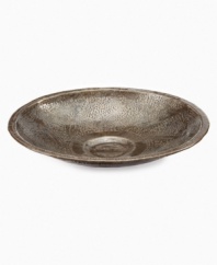 Recycled metal becomes a thing of beauty in the practiced hands of Haiti's esteemed Croix-des-Bouquets artisans. Carefully cut, hammered and varnished, this radiant Leaf bowl serves to hold jewelry, display whole fruit and accent coffee tables. A meaningful gift.