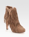 Allover fringe, hidden platform and an exposed back zipper enliven this on-trend, suede ankle boot. Self-covered heel, 4½ (115mm)Hidden platform, ½ (15mm)Compares to a 4 heel (100mm)Suede upperBack zipperLeather lining and solePadded insoleImported