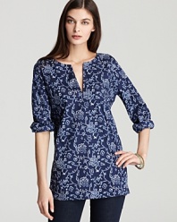Spring to life in this pure DKNY tunic. Fresh blossoms finish a silky silhouette for a style blooming with elegance.