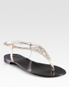 Pearly metallic leather thong sandal has an adjustable slingback strap and crystal-encrusted upper. Crystal-embellished metallic leather upperLeather lining and soleMade in ItalyOUR FIT MODEL RECOMMENDS ordering true size. 