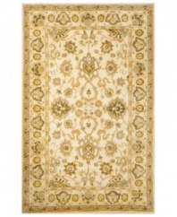 Drawing inspiration from the sandy ruins of ancient Petra and the traditional designs of India, this elegant, hand-tufted rug presents a rich decorative history set against a subtle ivory backdrop and accented with multiple gold and green tones.