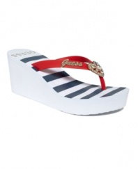 When your only decision is the beach or the boat. Kick back in style with the nautical-themed and always glamorous Sani2 wedge thong sandals by GUESS.
