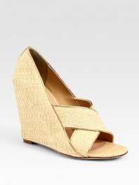 Trimmed in shimmery metallic leather, this woven raffia design has a high wedge and criss-cross straps. Raffia and metallic leather wedge, 4½ (115mm)Raffia and metallic leather upperLeather lining and solePadded insoleImportedOUR FIT MODEL RECOMMENDS ordering one half size up as this style runs small. 