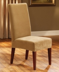Made of soft, waffle-textured memory stretch fabric, the Stretch Pique slipcover from Sure Fit perfectly form-fits your dining room chair for a designer look.