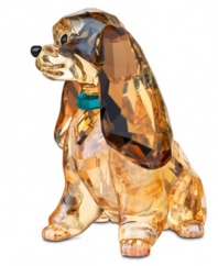 Retell the heartwarming story of Lady and the Tramp in dazzling Swarovksi crystal. Every bit as stunning as Disney's star cocker spaniel, the Lady figurine glistens in shades of gold and topaz with a Indicolite crystal collar.