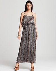 Work the safari trend into your daily repertoire with this Karen Kane maxi dress, boasting a graphic mix of tribal and animal prints. A ruffled bodice finishes the style with untamed femininity.