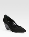 Tried-and-true suede pump with an unexpected patent leather wedge. Patent leather wedge, 3 (75mm)Suede upperLeather lining and solePadded insoleMade in ItalyOUR FIT MODEL RECOMMENDS ordering one size up as this style runs small. 