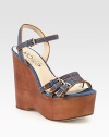 Skinny, adjustable straps in dazzling denim with leather trim and a towering wooden wedge. Wooden wedge, 5 (125mm)Wooden platform, 2 (50mm)Compares to a 3 heel (75mm)Denim and leather upperLeather lining and solePadded insoleImported