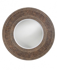 The Hampton mirror's round frame features a striking ring design that mimics a marble mosaic finished with a gorgeous patina. Its eclectic elegance makes it suitable for many contemporary spaces.