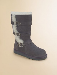A rustic-chic pair in cozy sheepskin and suede with three adjustable buckles for a just-right fit.Zip closureAdjustable bucklesCow suede upperSheepskin liningPadded insoleEVA soleImported
