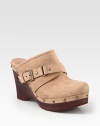 A retro-inspired suede favorite with edgy metal studs, an adjustable buckle strap and powerful wooden wedge. Wooden wedge, 4 (100mm)Wooden platform, 1¼ (30mm)Compares to a 2¾ heel (70mm)Suede upper with metal studsAdjustable buckle strapLeather liningRubber solePadded insoleImported