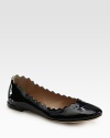 Shiny patent leather flat with a scalloped upper and comfy padded insole. Patent leather upperLeather lining and solePadded insoleMade in ItalyOUR FIT MODEL RECOMMENDS ordering true size. 